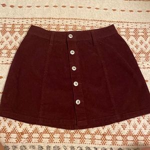 Dark maroon corduroy above knee button up skirt